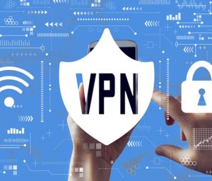 an image of a person holding up a smartphone and pointing with a finger at it, at the top of the smartphone there is a shield sign with the word VPN on it