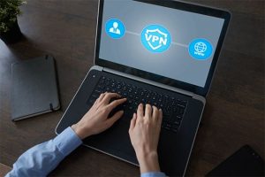 An image featuring a person using a laptop with VPN logos on it